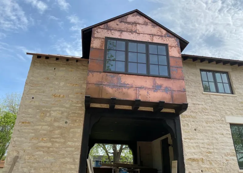 Copper metal panel facade on a stone building for Skylight Installation in Wappinger